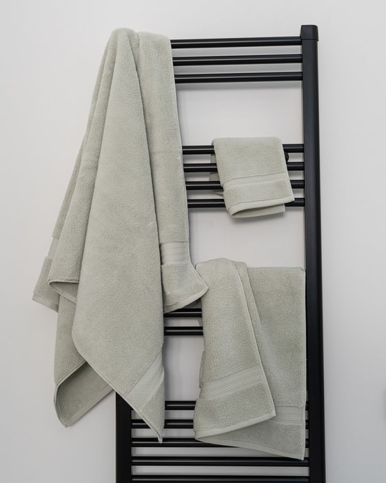 Sage Turkish cotton towels on a towel rail